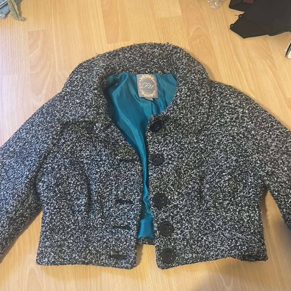 First like a small peacoat with button up cropped